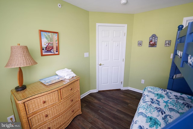 38337 N Mill Ln Unit 116, Ocean View, DE 19970 - bedroom with dark wood-style floors and baseboards