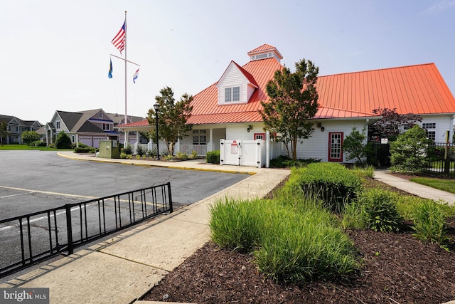 38337 N Mill Ln Unit 116, Ocean View, DE 19970 - view of front of property featuring a metal roof, a residential view, and a standing seam roof