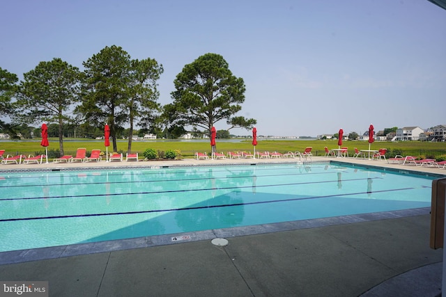 38337 N Mill Ln Unit 116, Ocean View, DE 19970 - community pool with a lawn and a patio area
