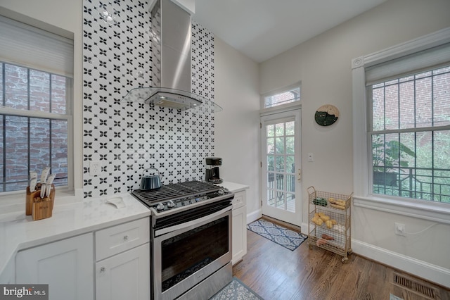 1842 N Capitol St NW, Washington, DC 20002 - kitchen featuring gas stove, wall chimney exhaust hood, wood finished floors, and white cabinetry