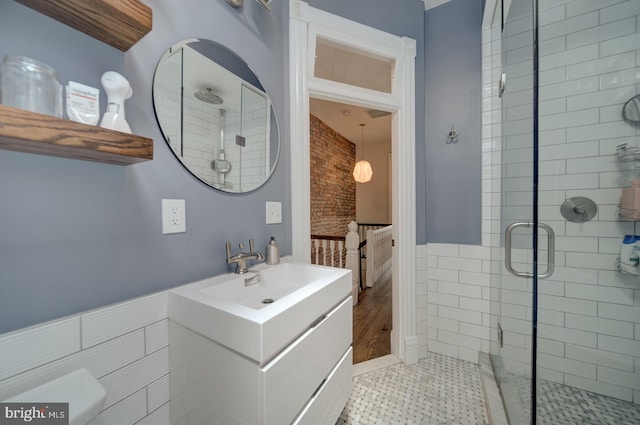 1842 N Capitol St NW, Washington, DC 20002 - bathroom featuring a shower stall, vanity, and a wainscoted wall