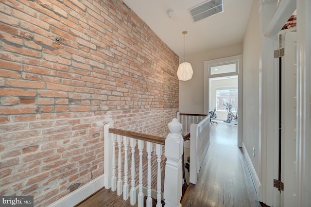 1842 N Capitol St NW, Washington, DC 20002 - hall featuring an upstairs landing, wood finished floors, and brick wall