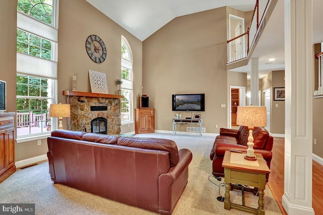 404 Herington Dr, Reading, PA 19608 - carpeted living room with a fireplace, high vaulted ceiling, healthy amount of natural light, and ornate columns