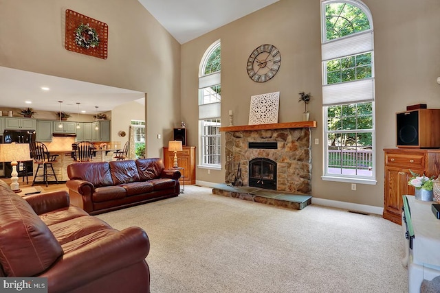 404 Herington Dr, Reading, PA 19608 - living area with a towering ceiling, plenty of natural light, light carpet, and a fireplace