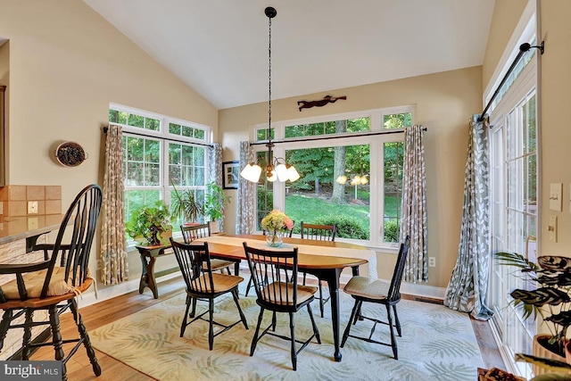 404 Herington Dr, Reading, PA 19608 - dining area with high vaulted ceiling, light wood finished floors, and a chandelier
