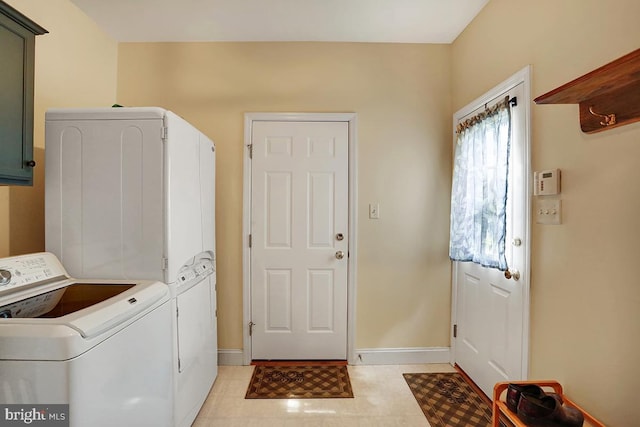 404 Herington Dr, Reading, PA 19608 - laundry area with cabinet space, washer and clothes dryer, and light tile patterned floors