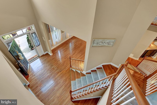 404 Herington Dr, Reading, PA 19608 - staircase featuring a towering ceiling and wood finished floors
