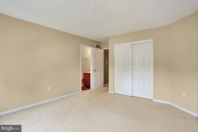 404 Herington Dr, Reading, PA 19608 - unfurnished bedroom featuring carpet flooring, a closet, and ensuite bath
