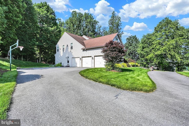 404 Herington Dr, Reading, PA 19608 - view of property exterior with a garage, driveway, and a yard