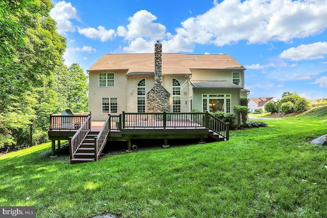 404 Herington Dr, Reading, PA 19608 - back of property with a wooden deck, a yard, and a chimney