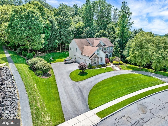 404 Herington Dr, Reading, PA 19608 - view of front facade with curved driveway, a front lawn, and stone siding