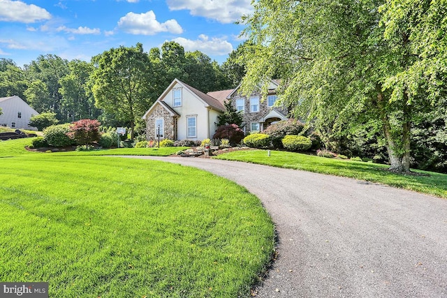 404 Herington Dr, Reading, PA 19608 - traditional-style house featuring stone siding, stucco siding, and a front lawn