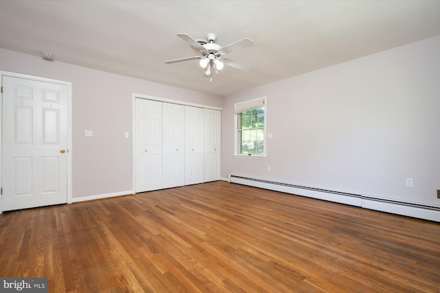 3990 View Top Rd, Ellicott City, MD 21042 - unfurnished bedroom with a baseboard radiator, wood finished floors, a closet, and a ceiling fan