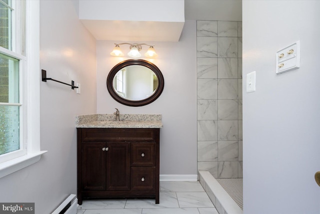 3990 View Top Rd, Ellicott City, MD 21042 - full bath with marble look tiles, vanity, healthy amount of natural light, and a tile shower