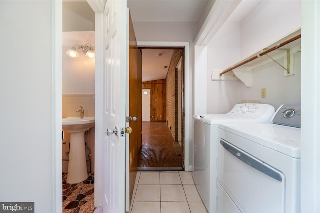 3990 View Top Rd, Ellicott City, MD 21042 - washroom with separate washer and dryer, tile walls, and light tile patterned flooring