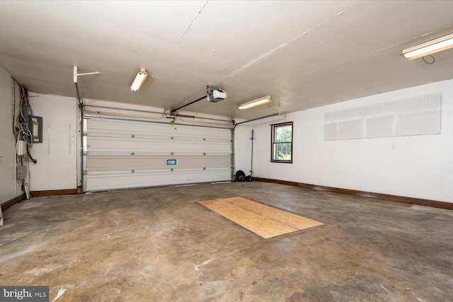 3990 View Top Rd, Ellicott City, MD 21042 - garage with a garage door opener and baseboards