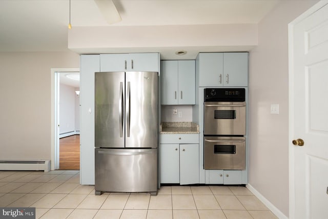 3990 View Top Rd, Ellicott City, MD 21042 - kitchen featuring appliances with stainless steel finishes, a baseboard heating unit, and light tile patterned flooring