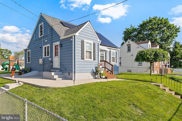 260 Irvington Pl, Hamilton, NJ 08610 - view of front of property featuring a shingled roof, entry steps, a patio, and solar panels