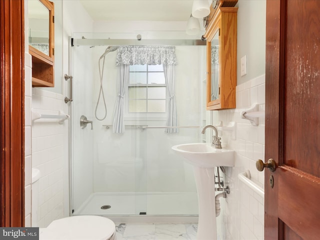 55 W Duck St, Front Royal, VA 22630 - bathroom with a stall shower, tile walls, marble finish flooring, and wainscoting