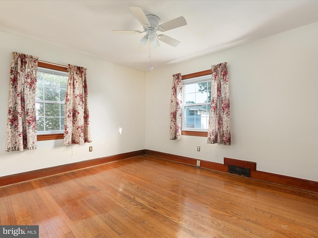 55 W Duck St, Front Royal, VA 22630 - empty room with plenty of natural light, wood finished floors, and ceiling fan