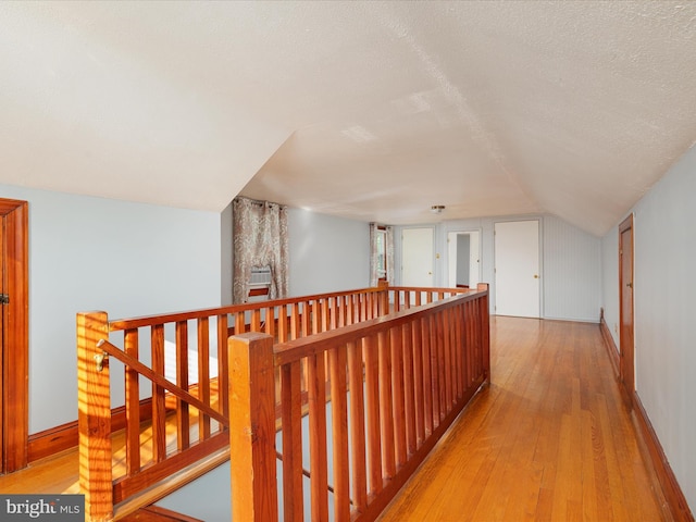 55 W Duck St, Front Royal, VA 22630 - hallway with an upstairs landing, light wood-style flooring, and vaulted ceiling
