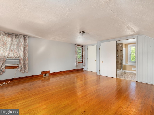 55 W Duck St, Front Royal, VA 22630 - spare room with a textured ceiling, wood finished floors, and cooling unit
