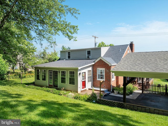 55 W Duck St, Front Royal, VA 22630 - rear view of house with roof with shingles, a patio area, entry steps, brick siding, and a carport