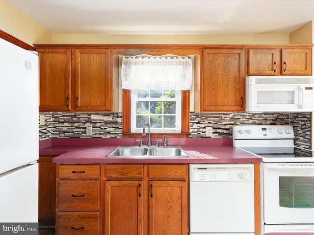 55 W Duck St, Front Royal, VA 22630 - kitchen featuring white appliances, backsplash, and brown cabinetry