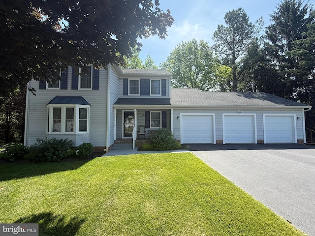 7 Old Farm Ln, New Freedom, PA 17349 - view of front of home with asphalt driveway, an attached garage, and a front lawn