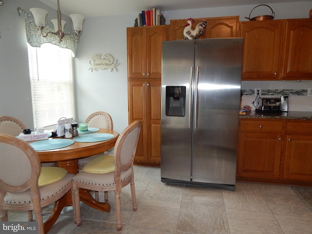 204 Kimary Ct Unit 1A, Forest Hill, MD 21050 - kitchen with stainless steel fridge, brown cabinets, backsplash, and dark stone countertops