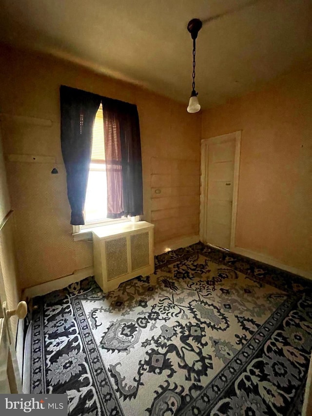 3831 N 19th St, Philadelphia, PA 19140 - spare room with baseboards and radiator heating unit