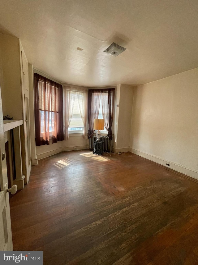 3831 N 19th St, Philadelphia, PA 19140 - unfurnished living room with wood finished floors and radiator