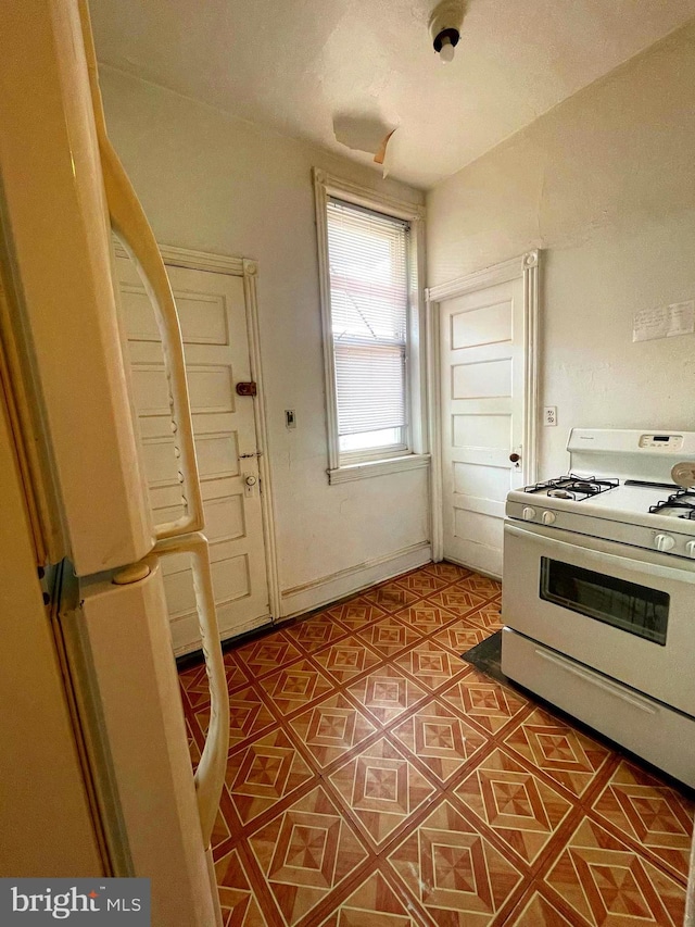 3831 N 19th St, Philadelphia, PA 19140 - kitchen featuring white appliances and tile patterned flooring