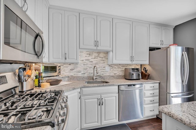 506 Masters Dr, Blackwood, NJ 08012 - kitchen with appliances with stainless steel finishes, decorative backsplash, and white cabinets
