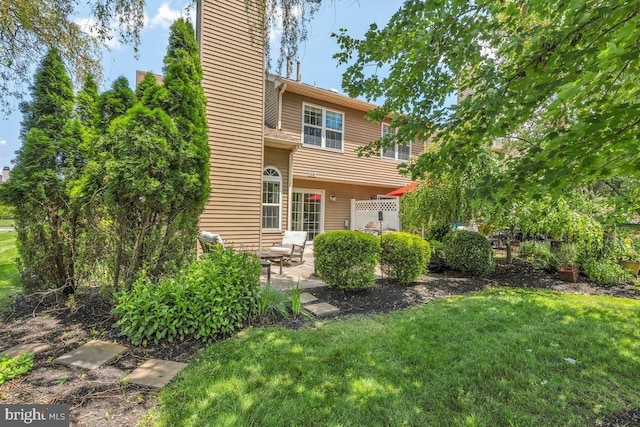 506 Masters Dr, Blackwood, NJ 08012 - back of house with a chimney, a patio, and a lawn