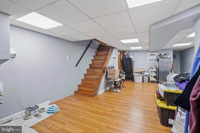 5563 Loretto Ave, Philadelphia, PA 19124 - game room with a paneled ceiling, wood finished floors, and a wall mounted air conditioner