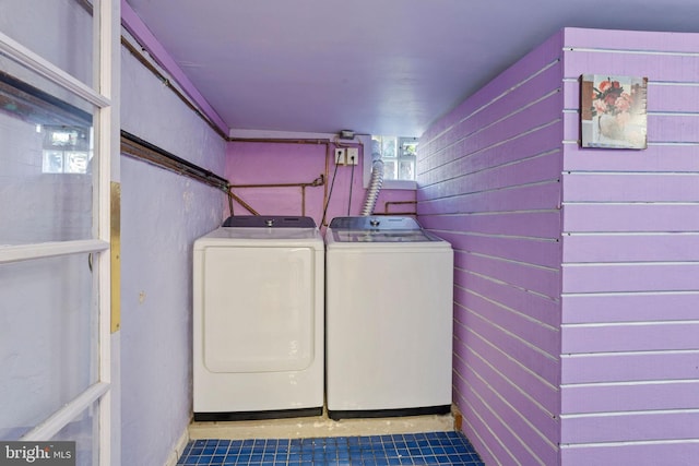 5563 Loretto Ave, Philadelphia, PA 19124 - laundry area with washer and dryer and wooden walls