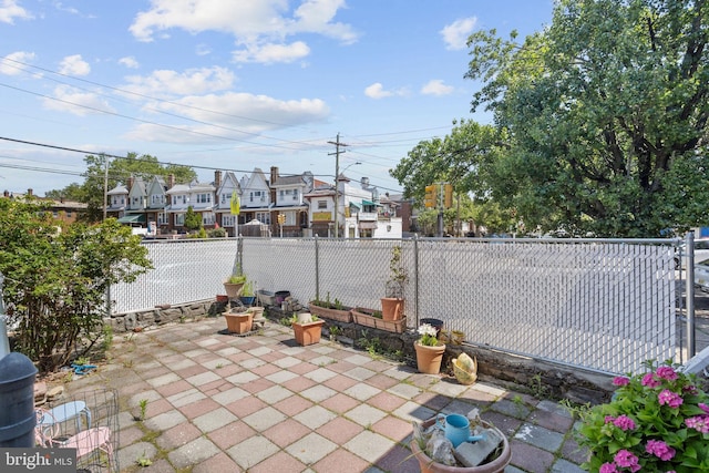 5563 Loretto Ave, Philadelphia, PA 19124 - fenced backyard with a patio area and a residential view