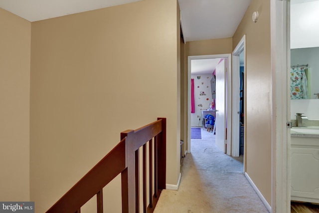 28 Wister Way, Reading, PA 19606 - hall with an upstairs landing and light colored carpet