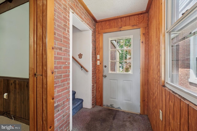 1102 Walnut, Collingdale, PA 19023 - entryway with wood walls, stairs, and carpet floors