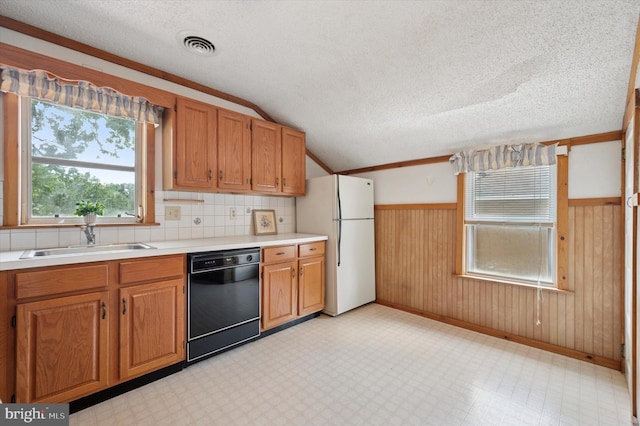 1102 Walnut, Collingdale, PA 19023 - kitchen with dishwasher, freestanding refrigerator, light countertops, a textured ceiling, and wainscoting