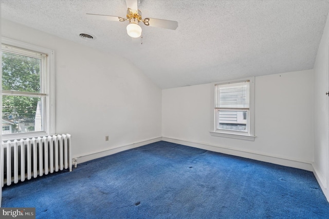 1102 Walnut, Collingdale, PA 19023 - bonus room featuring radiator, carpet, a textured ceiling, vaulted ceiling, and a ceiling fan