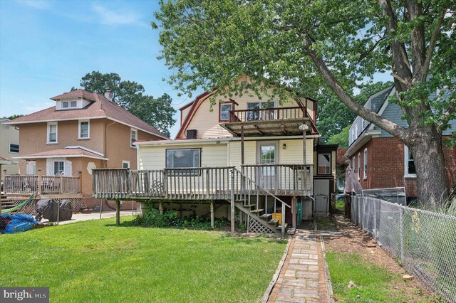 1102 Walnut, Collingdale, PA 19023 - back of house featuring a balcony, a fenced backyard, a deck, and a gambrel roof