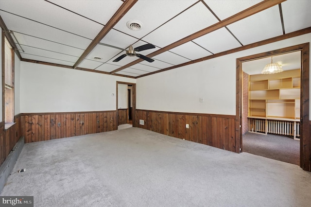 1102 Walnut, Collingdale, PA 19023 - carpeted empty room with a wainscoted wall, ceiling fan, and wood walls