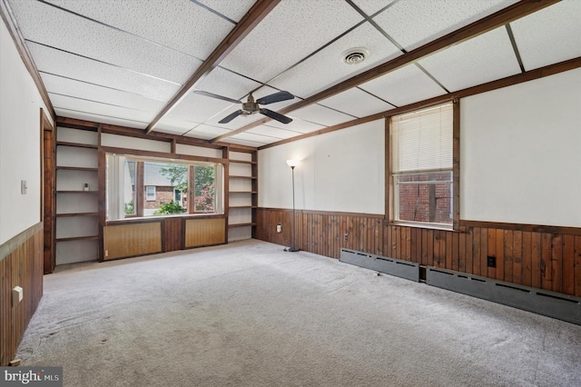 1102 Walnut, Collingdale, PA 19023 - carpeted empty room with a wainscoted wall, wooden walls, a ceiling fan, and a baseboard radiator
