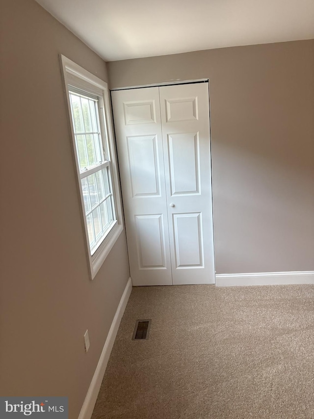 1708 Granite Ct, Crofton, MD 21114 - unfurnished bedroom featuring light carpet and a closet