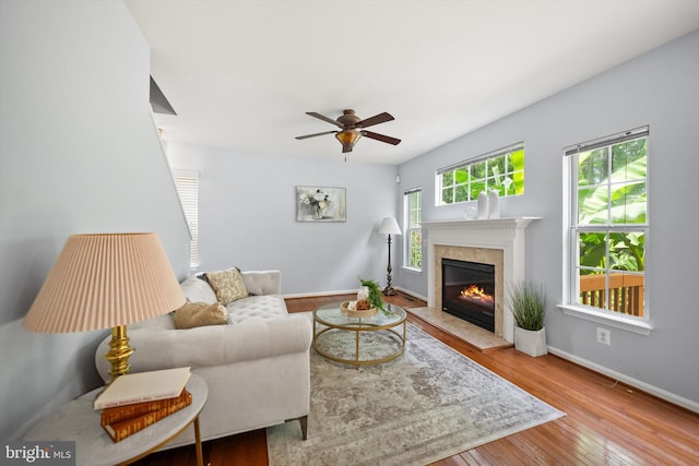 14908 Slippery Elm Ct, Woodbridge, VA 22193 - living area with a premium fireplace, hardwood / wood-style floors, and a ceiling fan