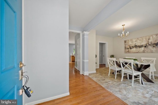 14908 Slippery Elm Ct, Woodbridge, VA 22193 - dining space with light wood finished floors and a chandelier