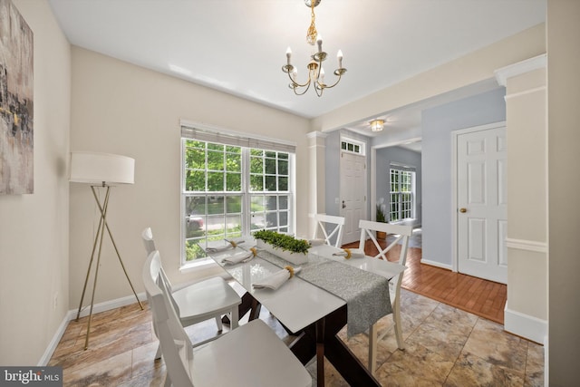 14908 Slippery Elm Ct, Woodbridge, VA 22193 - dining area featuring plenty of natural light, a chandelier, and ornate columns