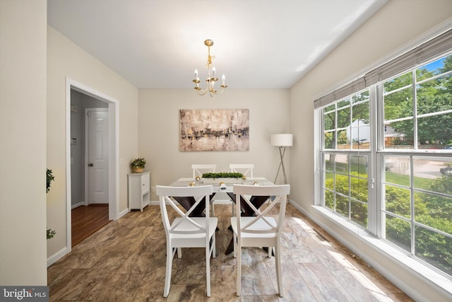 14908 Slippery Elm Ct, Woodbridge, VA 22193 - dining room featuring a chandelier and baseboards